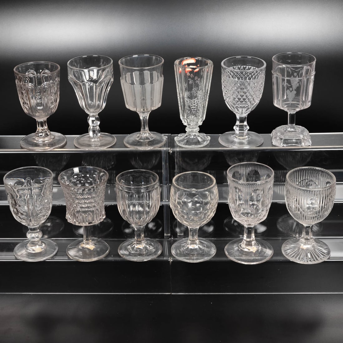 12 EAPG Pressed Glass Goblets: Twelve American Pressed Glass Goblets, 19th-20th Centuries, Having two, three (tri-mold) or four mold joints. Patterns Comprising: Double Knob Flute, 1880's; Hair Pin Loop with Thumbprint, 1870's;