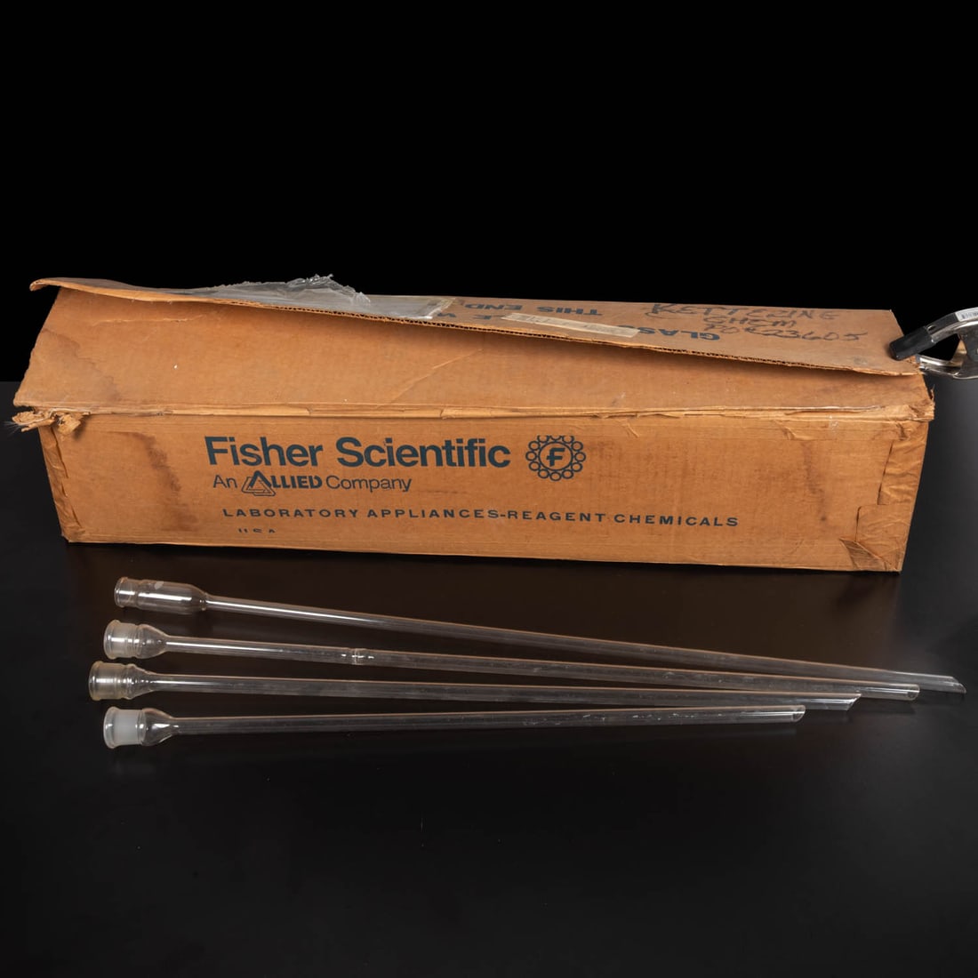 56 Laboratory Glass Thistle Tubes: Fifty-six Laboratory Glass Thistle Tubes of Various Lengths, 20th Century, 30 Pyrex 24/25, 20 marked K USA and 6 without legible maker's marks. Thistle tubes feature a long, thin stem topped with a