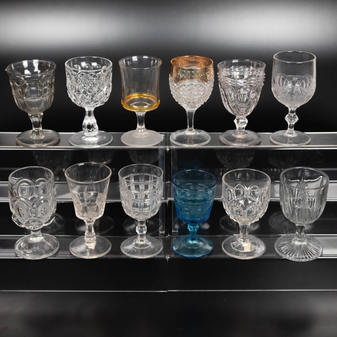 12 EAPG Pressed Glass Goblets: Twelve American Pressed Glass Goblets, 19th-20th Centuries, Having two, three (tri-mold) or four mold joints. Patterns Comprising: Shell and Tassel, 1870's; Finecut Medallions, 1900; Stedman with