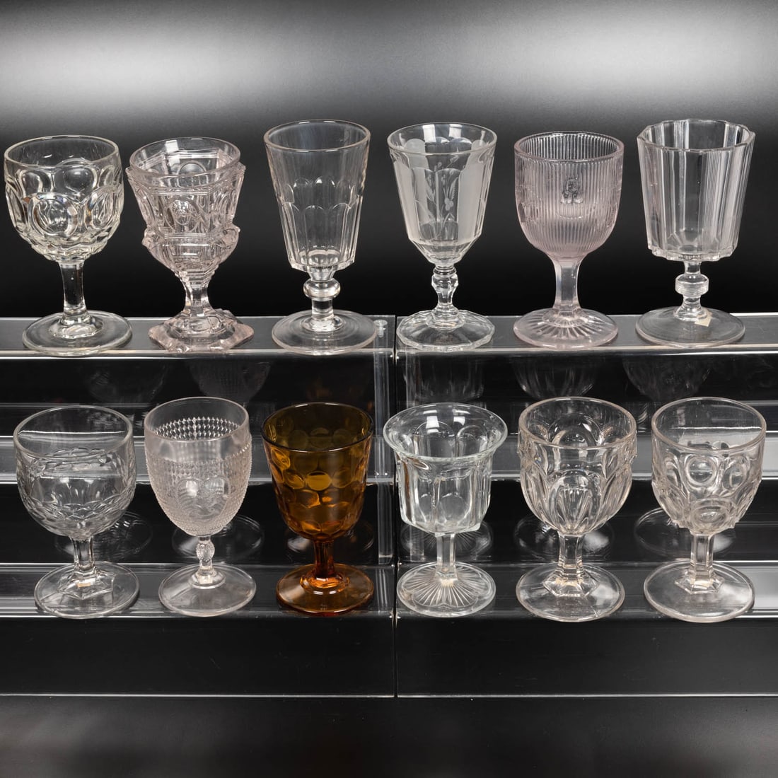 12 EAPG Pressed Glass Goblets: Twelve American Pressed Glass Goblets, 19th-20th Centuries, Having two, three (tri-mold) or four mold joints. Patterns Comprising: Texas Bull's Eye, 1870's; Terraced O's, 1850's; Ten Panel Flute, 1890