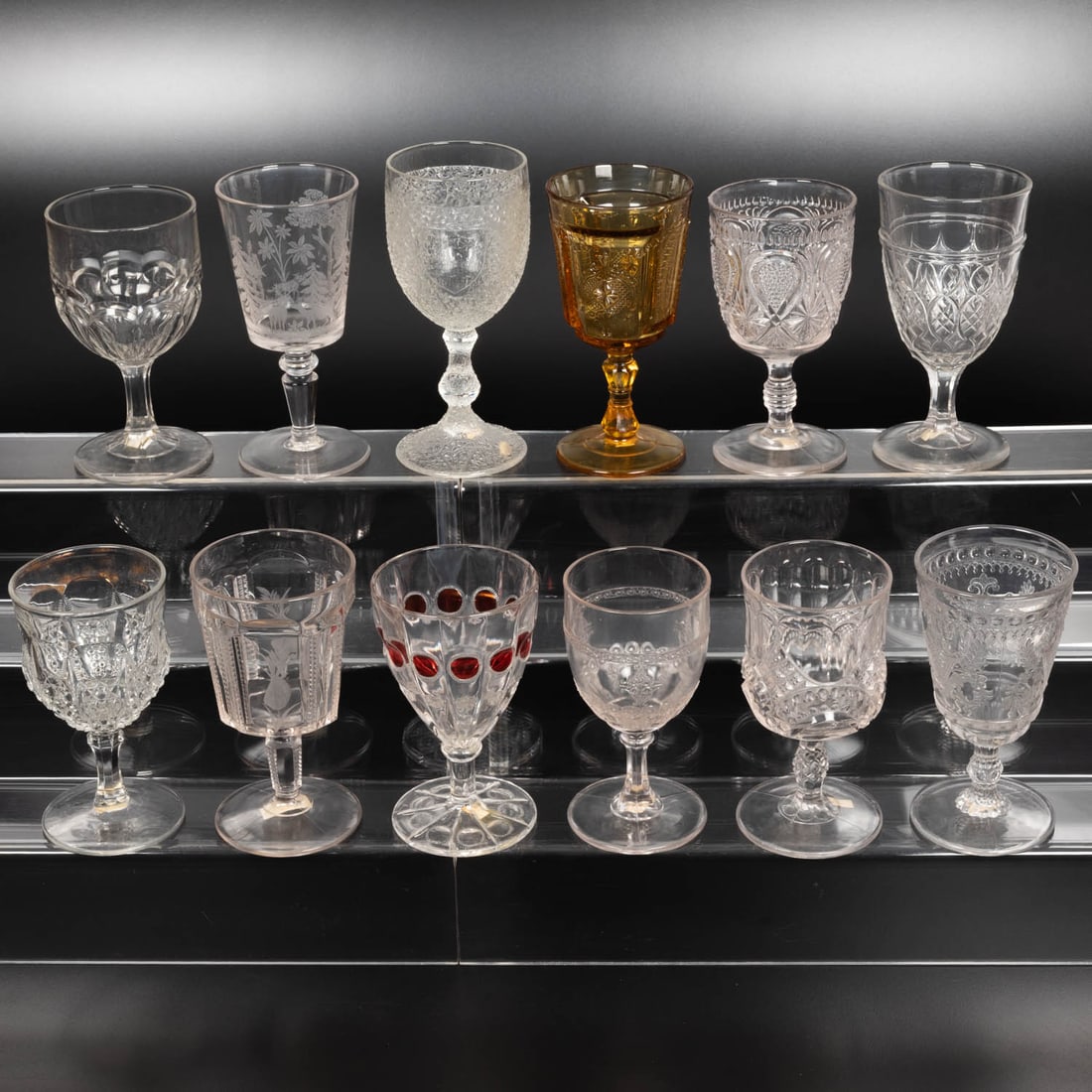 12 EAPG Pressed Glass Goblets: Twelve American Pressed Glass Goblets, 19th-20th Centuries, Having two, three (tri-mold) or four mold joints. Patterns Comprising: Tree of Life with Shield, 1860's; Odd Fellow, 1880's; Medallion, 1870