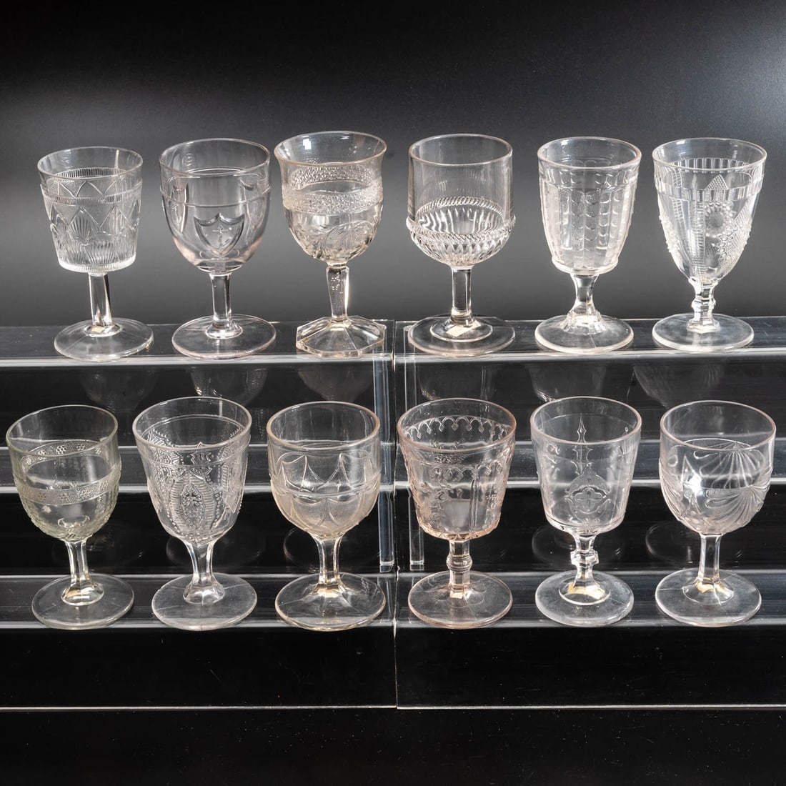 12 EAPG Pressed Glass Goblets: Twelve American Pressed Glass Goblets, 19th/20th Century, Having two, three (tri-mold) or four mold joints. Comprising: Cord and Bars, 1880s; Daisy Medallion, 1870s; Forget-me-not in Festoons,