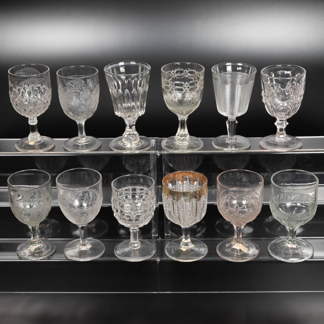 12 EAPG Pressed Glass Goblets: Twelve American Pressed Glass Goblets, 19th-20th Centuries, Having two, three (tri-mold) or four mold joints. Patterns Comprising: Swirled Column, 1890; Escelsior, 1850's; Grand Flint, 1860's; Blaze w