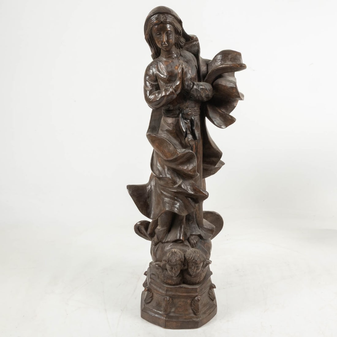 A Spanish Colonial Style Carved Wood Madonna Figure: A Spanish Colonial Style Carved Wood Madonna Figure, 20th Century, H: 36 x W: 10 x D: 15 in.