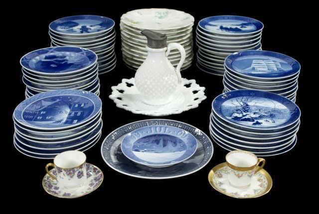 A Collection of Royal Copenhagen Porcelain Christmas Pl: A Collection of Royal Copenhagen Porcelain Christmas Plates, 20th Century, Together with C. Ahrenfeldt Limoges dessert plates, a pair of limoges demitasses cups, and a white milk glass plate and syrup