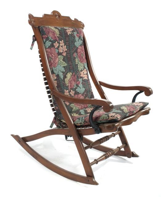 A Victorian Walnut Adjustable Patent Rocking Chair, 19t: A Victorian Walnut Adjustable Patent Rocking Chair, 19th Century, With cast iron fittings. Dimensions: h: 41.5 x w: 20 x d: 36 in. Other Notes: *** Please inquire for shipping estimate prior to biddin