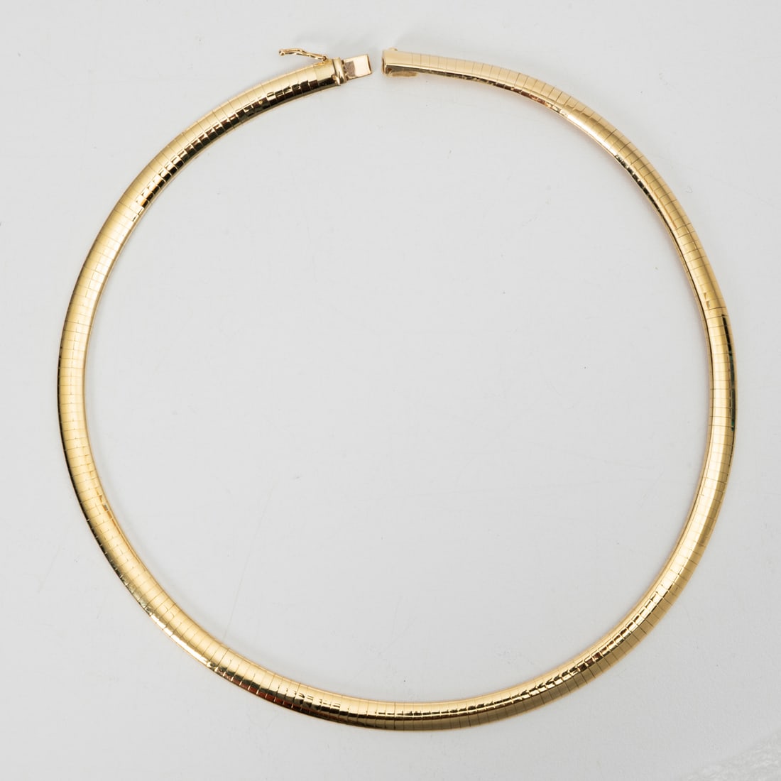 14K Yellow Gold Domed Omega Necklace: 14K Yellow Gold Domed Omega Necklace, Marked 14K Italy. 16 inch length x 6 mm thick. Weight approximately dwt 23.6.