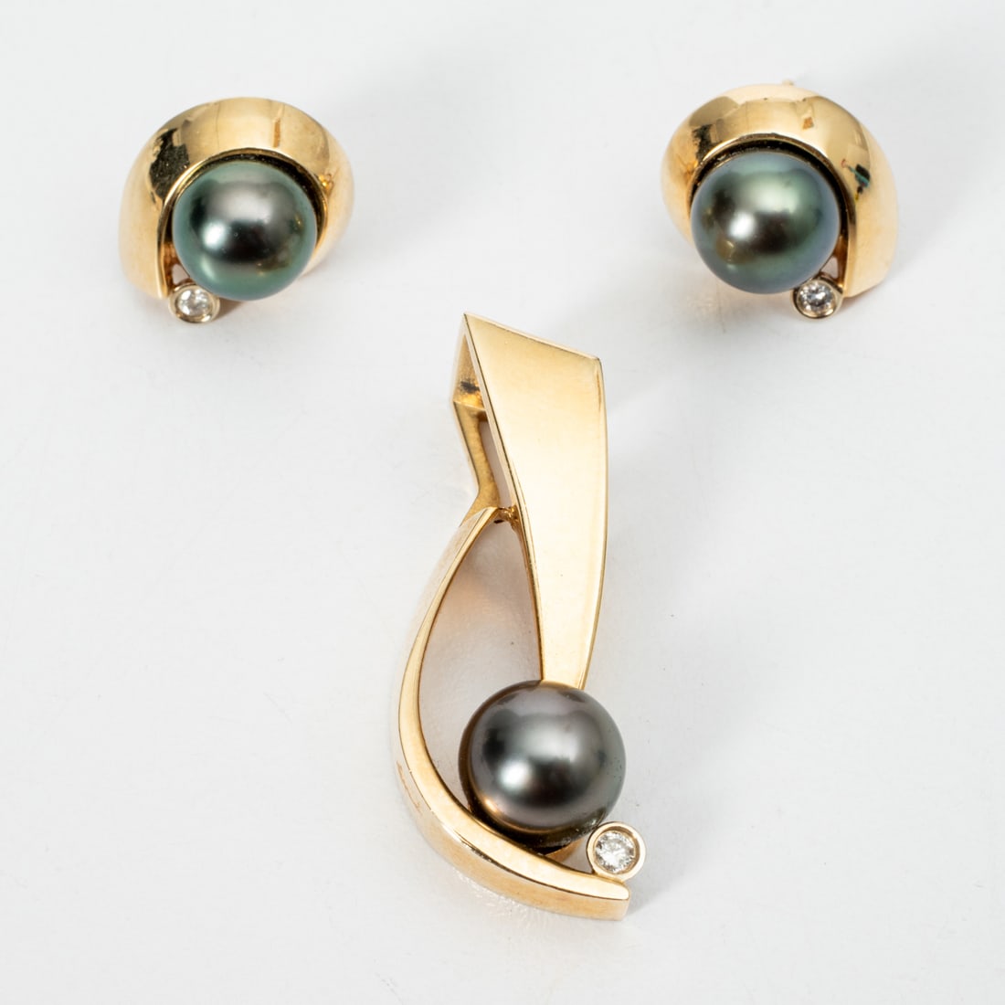 14K Yellow Gold Cultured Black Pearl and Diamond Earrings and Pendant: 14K Yellow Gold Cultured Black Pearl and Diamond Earrings and Pendant, The earrings are each set with one cultured black pearl approximately 8 mm. Also set with one round cut diamond each