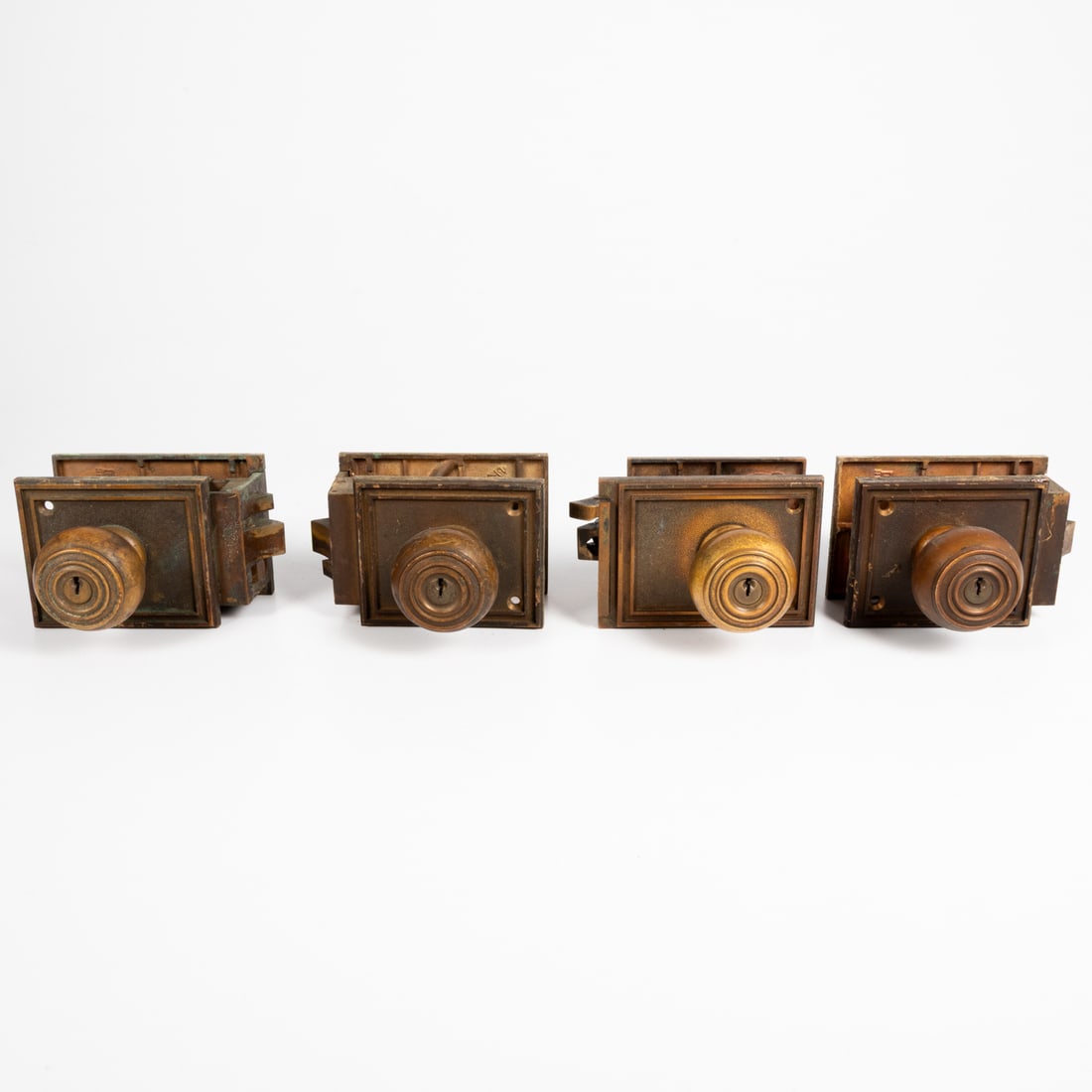 Four Antique Bronze Door Knob and Locking Mechanism Sets: Four Antique Bronze Door Knob and Locking Mechanism Sets, 19th / 20th Century, Manufactured by Sargent, New Haven, Conn, USA. Missing keys. H: 7 x W: 5 x D: 3 1/2 in.