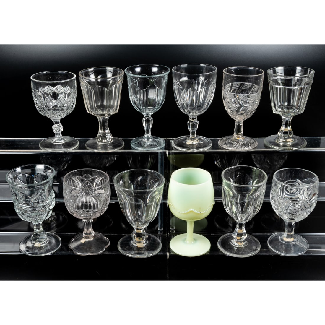 12 EAPG Pressed Glass Goblets: 12 EAPG Pressed Glass Goblets, late 19th - early 20th Century. Having two, three (tri-mold) or four mold joints. Various Makers. Tallest: 6 1/2 in.