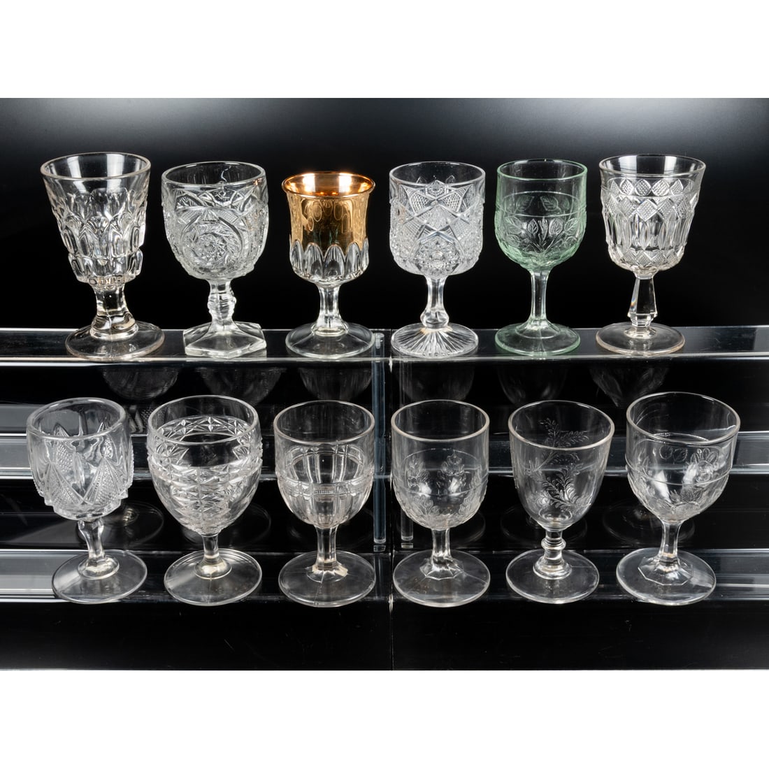 12 EAPG Pressed Glass Goblets: 12 EAPG Pressed Glass Goblets, late 19th - early 20th Century. Having two, three (tri-mold) or four mold joints. Various Makers. Tallest: 6 1/2 in.