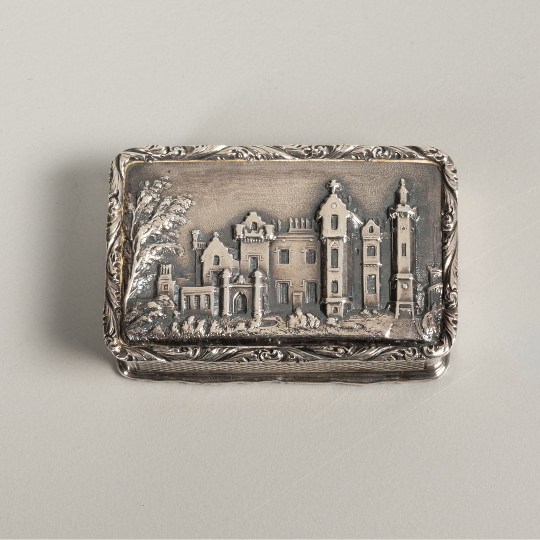 A English Sterling Silver Vinaigrette: A English Sterling Silver and Gilt Vinaigrette, 19th Century, The outer lid depicts the Abbotsford House. The maker's mark is for the Taylor & Perry Silversmiths circa 1847. It is monogrammed with M.T