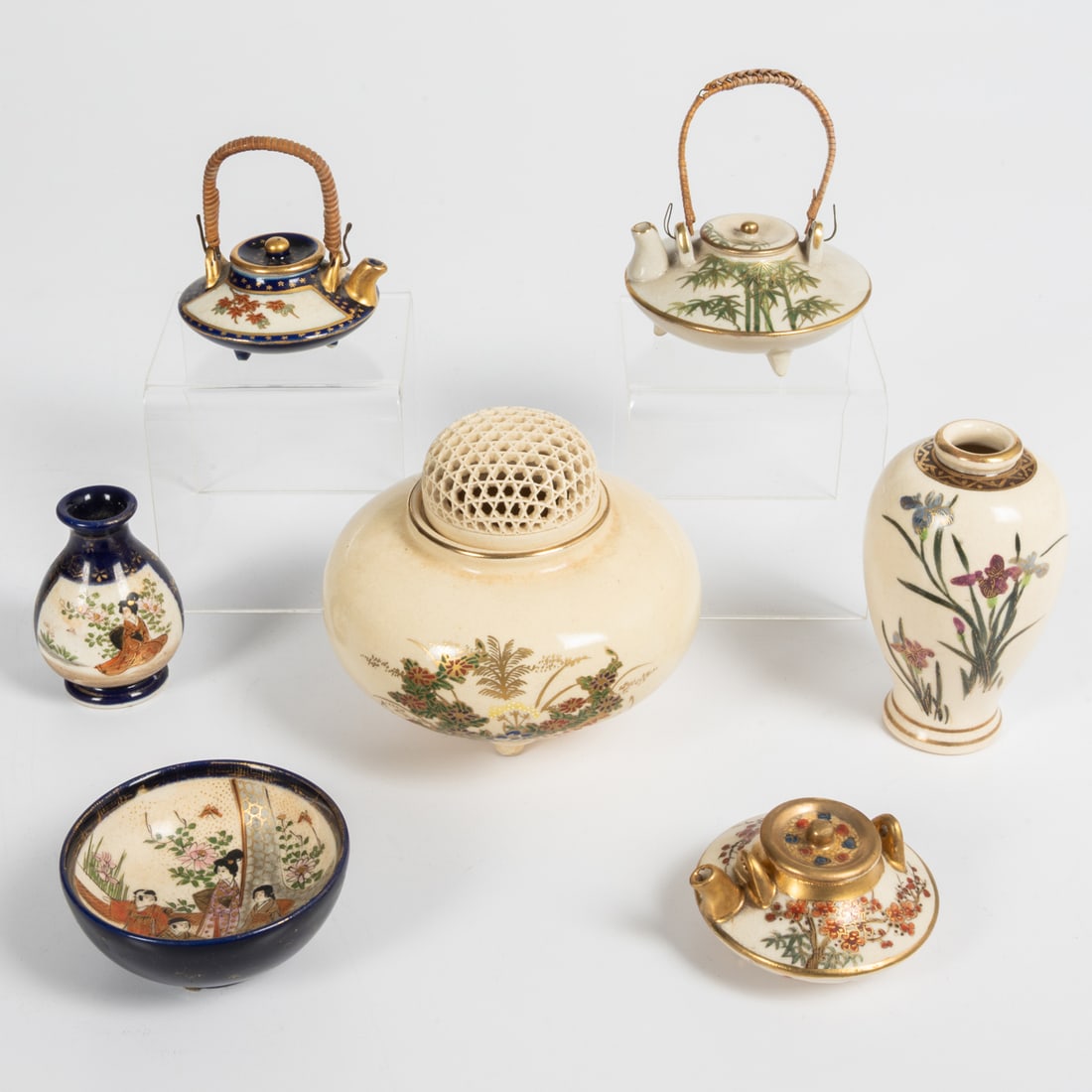 7 Japanese Satsuma Decorative Items: Seven Japanese Satsuma Earthenware Decorative Items, Late Meiji Period. Comprising an incense burner and six diminutive items ? three teapots, two vases, and a bowl. The undersides of the items are ma