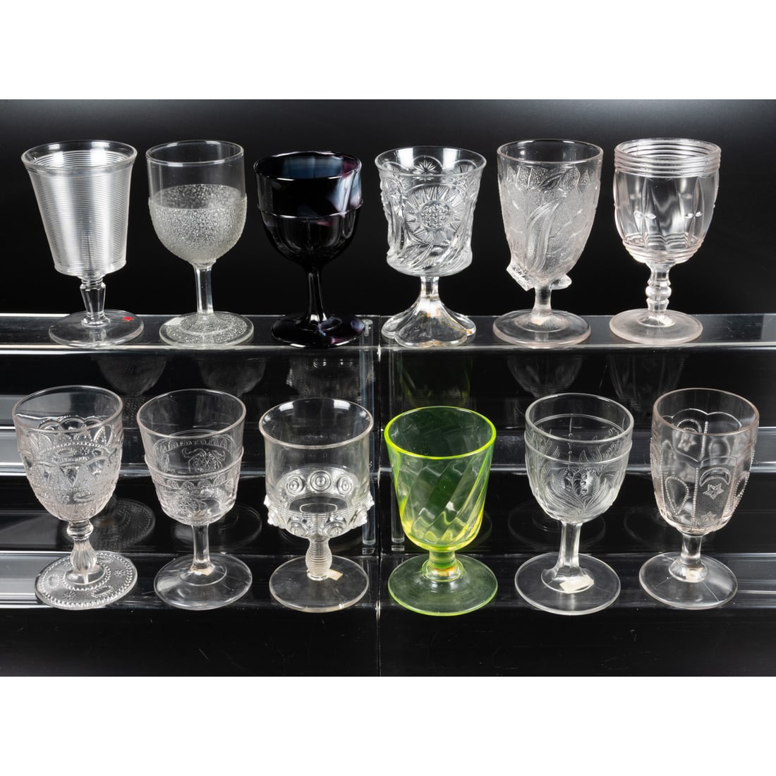 12 EAPG Pressed Glass Goblets: 12 EAPG Pressed Glass Goblets, Late 19th - Early 20th Century. Having two, three (tri-mold) or four mold joints. Various Makers. Patterns Comprising: Threaded, 1880s; Orange Peel, 1875; Lacy Dewdrop,
