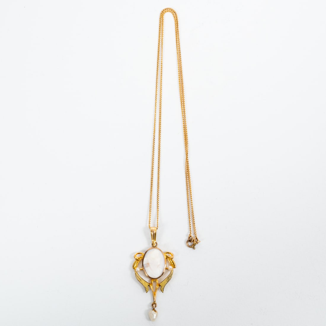A 10kt. Yellow Gold Plated Lavaliere: A 10kt. Yellow Gold Plated Lavaliere with a Shell and Pearl Cameo Pendent, 19th Century, Lavaliere Chain, L: 16 in. Pendent, L: 3/4 x W: 1 1/2 in. Total Approx. Weight with Pendent, 1.7 dwt.