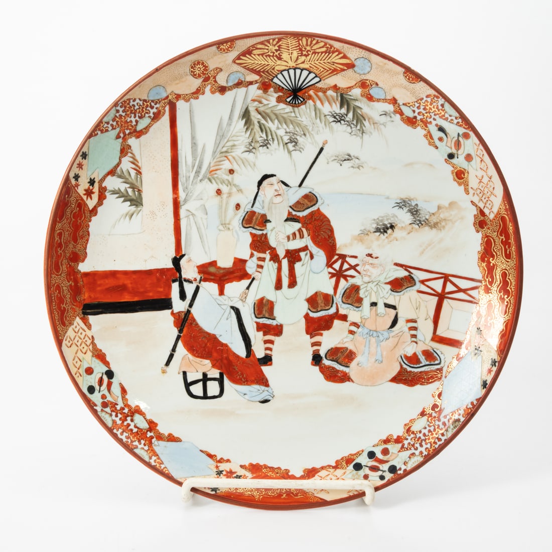 A Japanese Kutani Charger: A Japanese Kutani Porcelain Charger, Late Meiji Period. Underside marked with Kutani-zo maker's mark H: 2 D: 13 1/8 in.