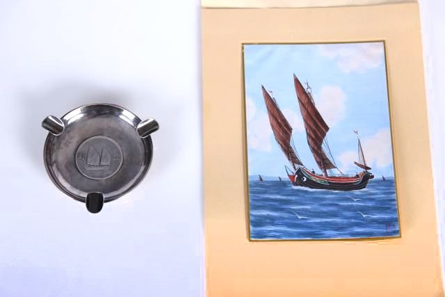 A Republic of China Junk Silver Dollar Mounted: A Republic of China Junk Silver Dollar Mounted in a Silver Ashtray, 1934, Engraved H.P.S. for Hans P. Sorensen founder of the Square and Compass Club of Shanghai. Together with a watercolor of ""Taipi