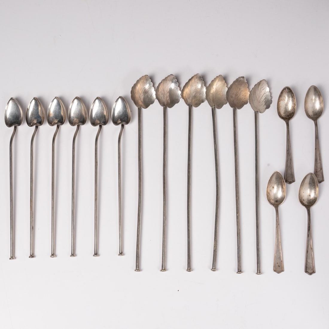 12 Sterling Silver Sipper Straws: Twelve Sterling Silver Iced Tea or Mint Julep Sipper Straws, 20th Century Comprising six Mexican Hector Aguilar mint leaf straws, length; 8 3/4 in. Six Whiting sterling silver heart form straws,