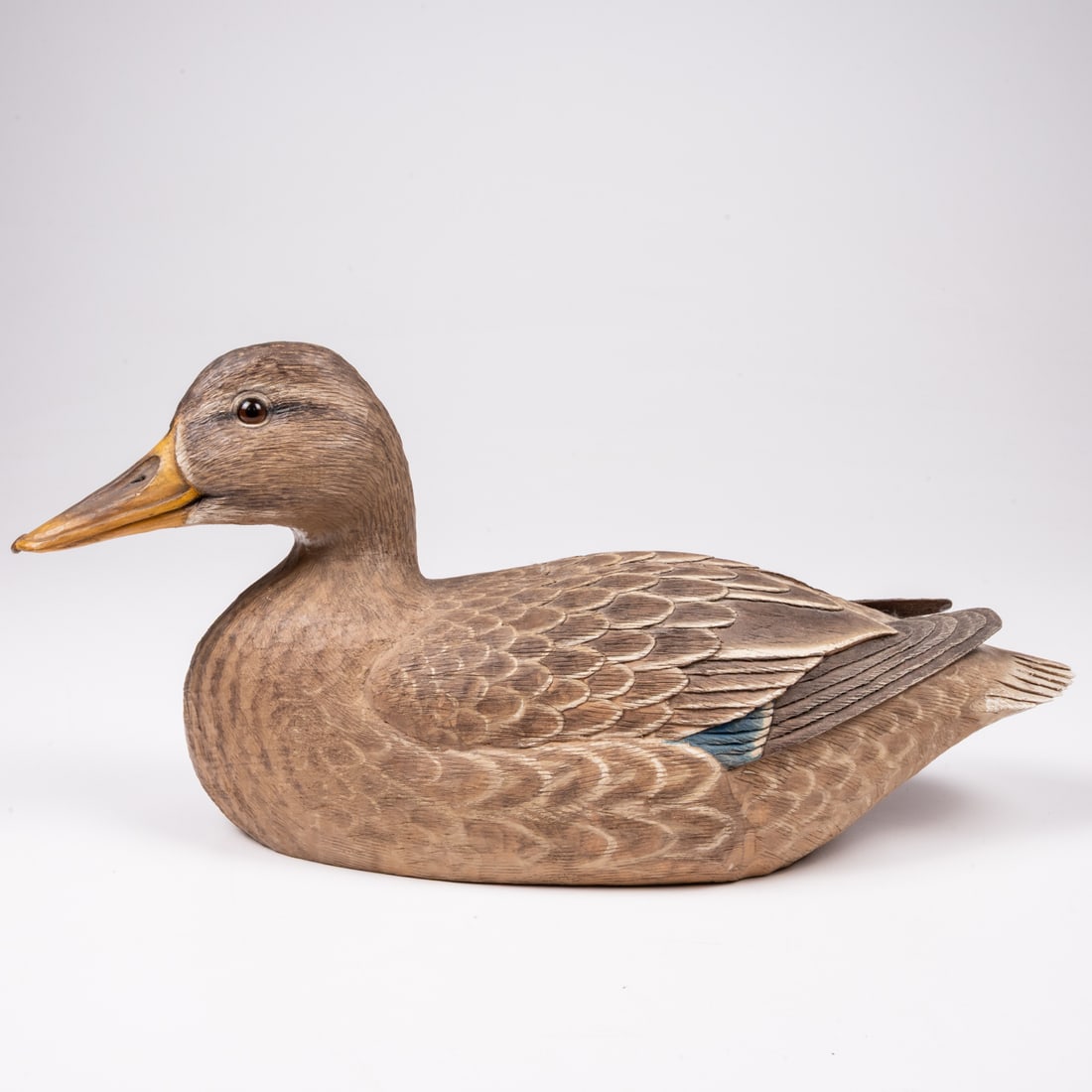 A Mallard Hen Duck Decoy by Stan Sparre: A Mallard Hen Duck Decoy by Stan Sparre (Cape Cod, 1923 - 2011), Carved and painted hardwood, having slightly turned head with glass eyes, signed on underside. H: 7 W: 14 D: 5 1/2 in.