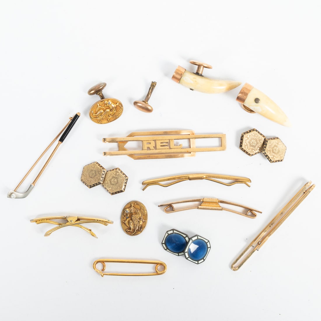 A Group of Gentlemen's Gold Jewelry: A Group of Gentlemen's 14kt & 10kt Gold Jewelry, Comprising a 14kt yellow gold money clip with RE monogram; a golfclub tie pin; and a pair of cufflinks. Low karat gold are two tie clips and two pairs