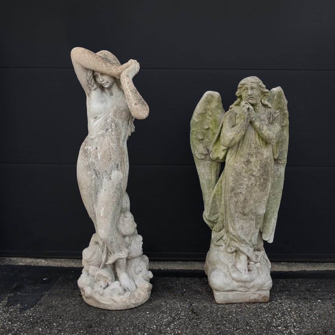 Two Cast Cement Garden Figures: Two Cast Cement Garden Figures, 20th Century, One depicting an angel and the other a woman. Woman, H: 48 x W: 15 x D: 15 in.