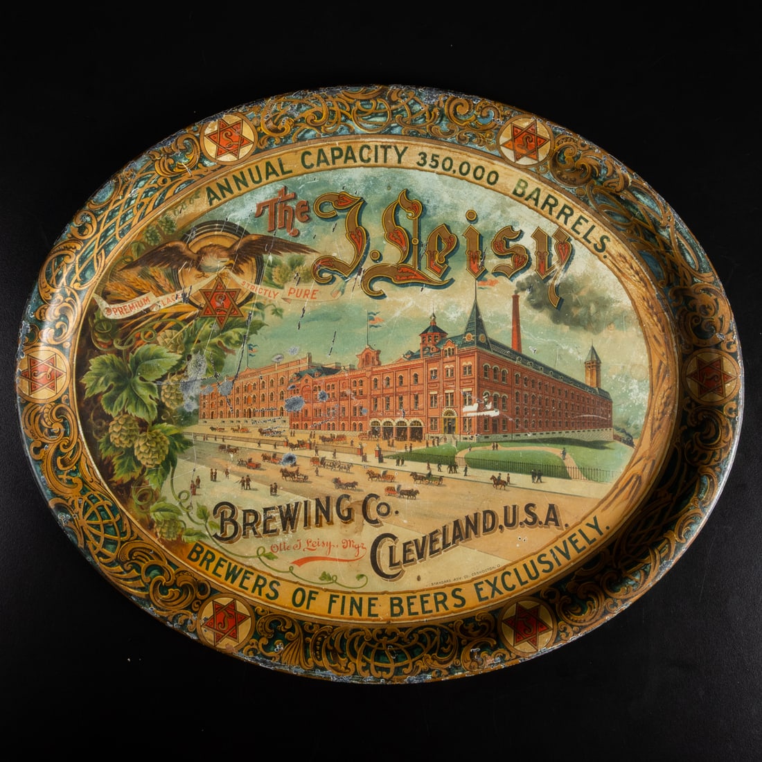 A Leisy Brewing Co. Tin Lithograph Beer Tray: A Leisy Brewing Company Cleveland, Ohio Tin Lithograph Advertising Beer Tray, ca. 1890's, Made by the Standard Advertising Company Coshocton Ohio. Dims, L: 16 1/2 x W: 13 1/2 in.