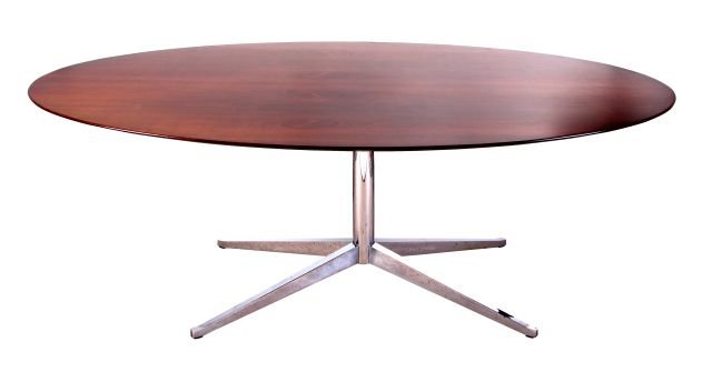 A Florence Knoll Rosewood and Chrome Oval Dining Table,: A Florence Knoll Rosewood and Chrome Oval Dining Table, 20th Century, With a chrome steel pedestal base. Dimensions: h: 28 x w: 78 x: d: 48 in.