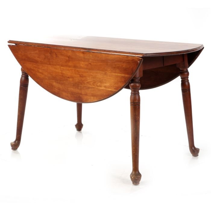 An American Queen Anne Style Cherry Drop Leaf Table,: An American Queen Anne Style Cherry Drop Leaf Table, 20th Century. Dimensions: h: 29 x dia: 50 in.
