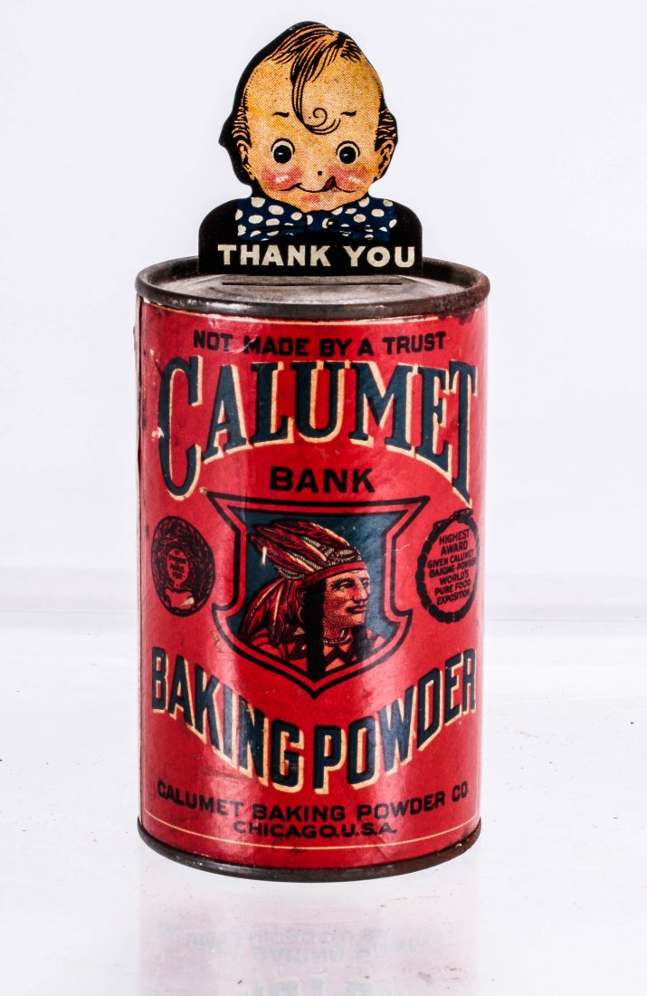 A Paper-Covered Tin Calumet Bank Manufactured by: A Paper-Covered Tin Calumet Bank Manufactured by Calumet Baking Powder Co., ca. 1924, Insert a coin in the slot. The weight of the coin causes the boy to move back and forth as if to express his thank