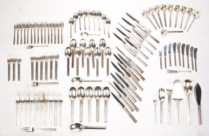 A Jean Puiforcat (1897-1945) Sterling Silver Flatware: A Jean Puiforcat (1897-1945) Sterling Silver Flatware Service in the Cannes Pattern, Designed ca. 1928, Comprising of ten dinner knives, eleven dinner forks, ten table spoons, ten soup spoons, ten sal