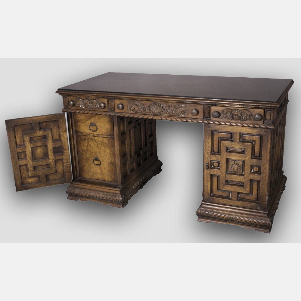 A Spanish Colonial Style Carved Oak Desk, 20th Century. (1 of 4)
