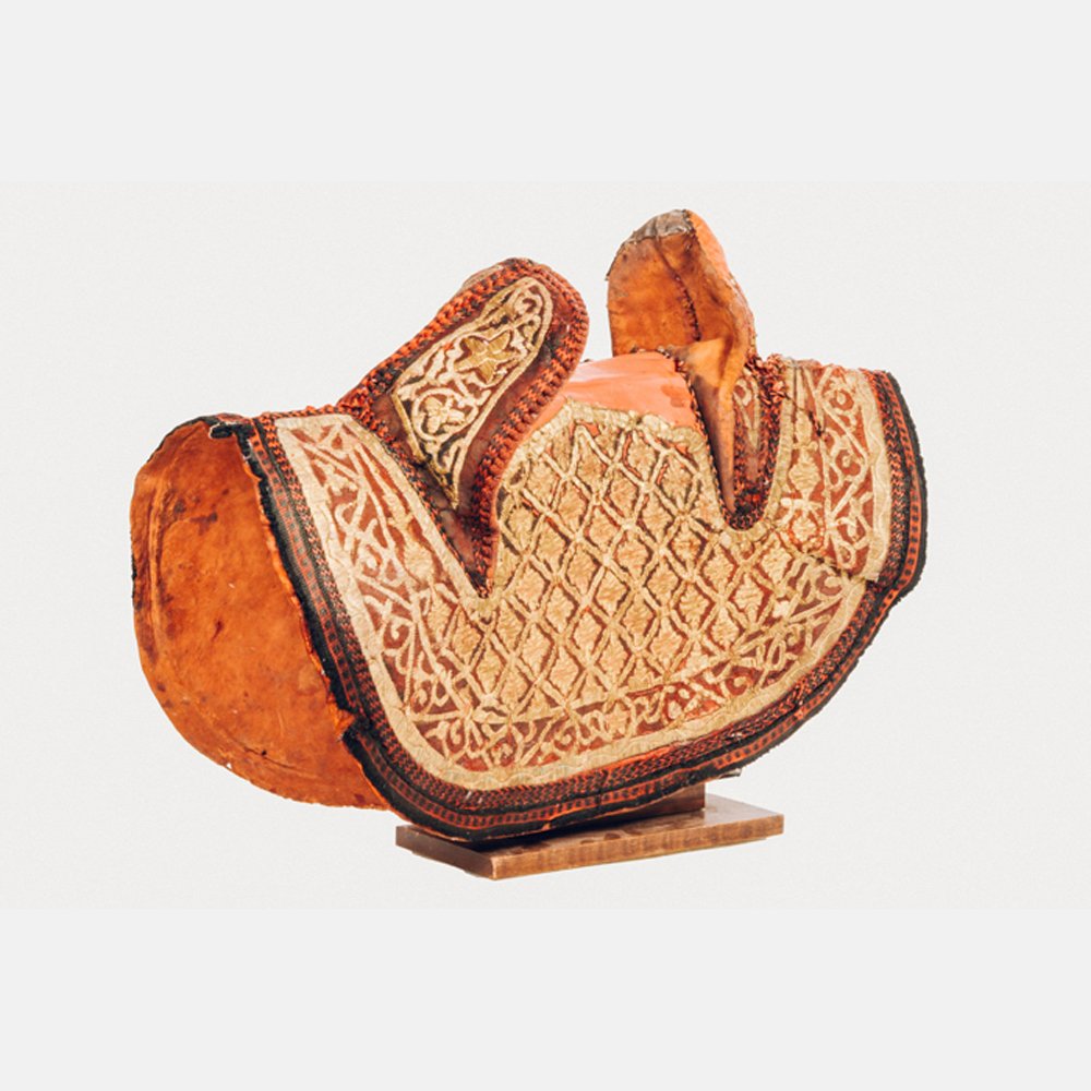 A Traditional Arabian Style Leather and Metallic: A Traditional Arabian Style Leather and Metallic Embroidered Saddle, 20th Century.