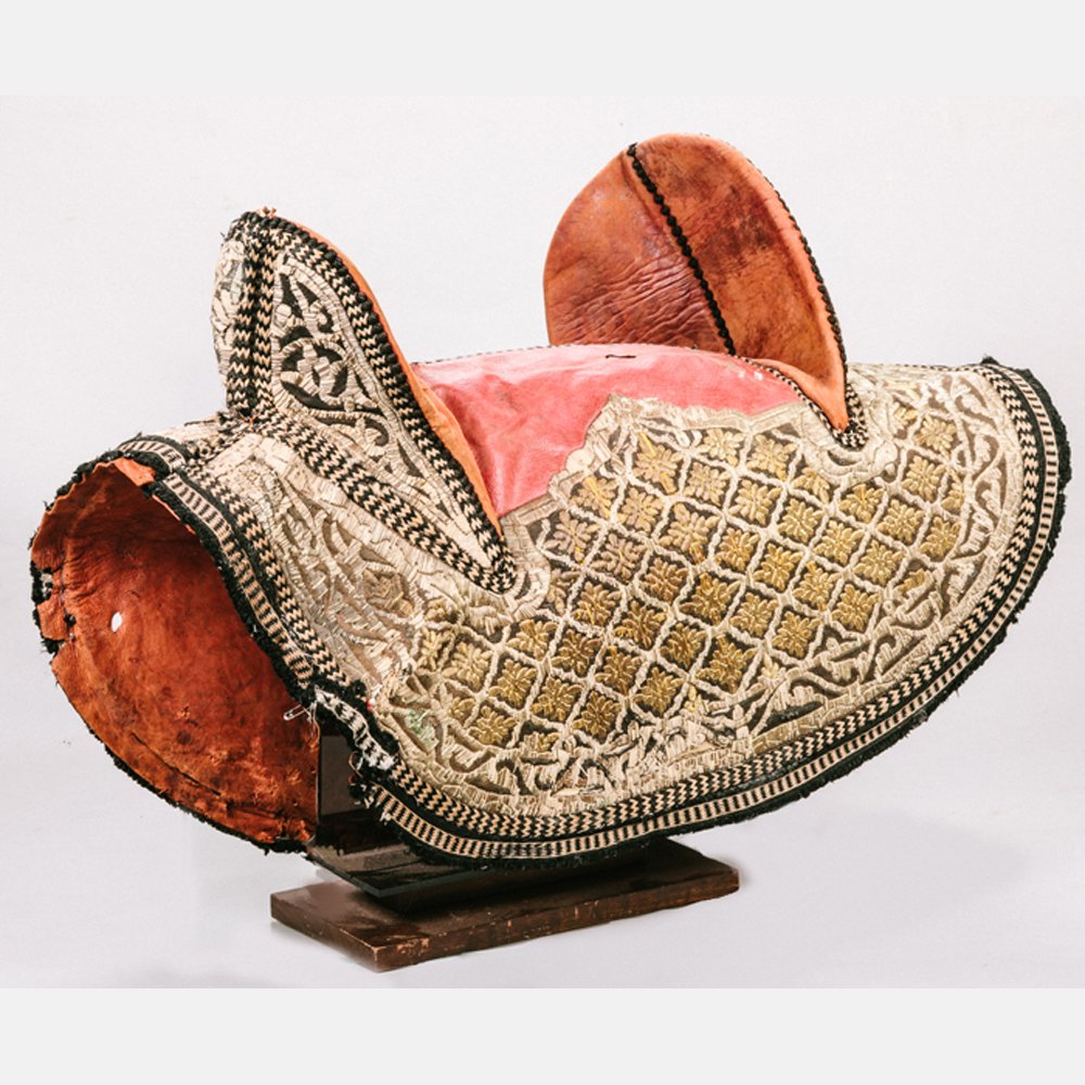 A Traditional Arabian Style Leather and Metallic: A Traditional Arabian Style Leather and Metallic Embroidered Saddle, 20th Century.
