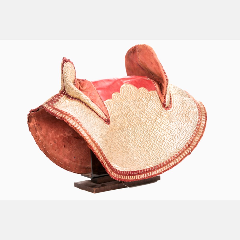 A Traditional Arabian Style Leather and Embroidered: A Traditional Arabian Style Leather and Embroidered Saddle, 20th Century.