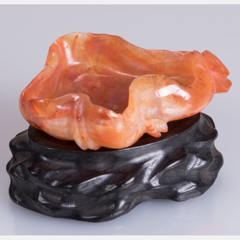 A Chinese Carved Agate Lotus Leaf Form Washer on a (1 of 4)