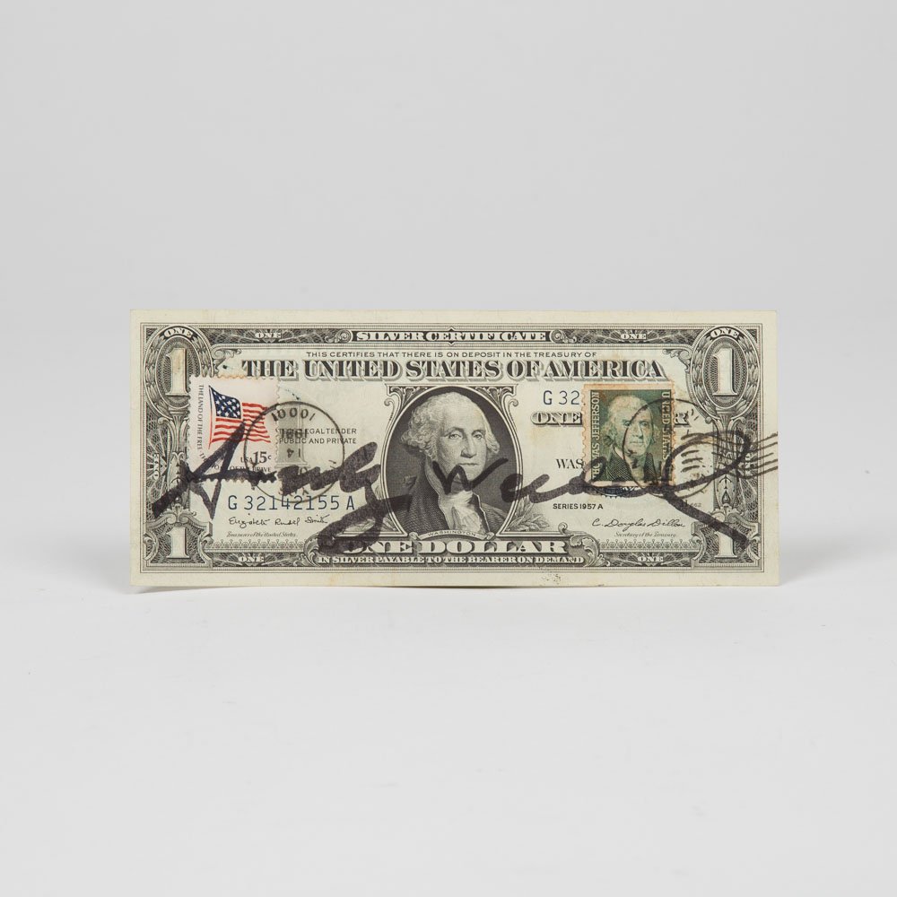 Andy Warhol (1928-1987) One Dollar, US-American one: Andy Warhol (1928-1987) One Dollar, US-American one dollar bill with two canceled stamps, Signed in felt pen on front and stamped 'Andy Warhol' on verso.