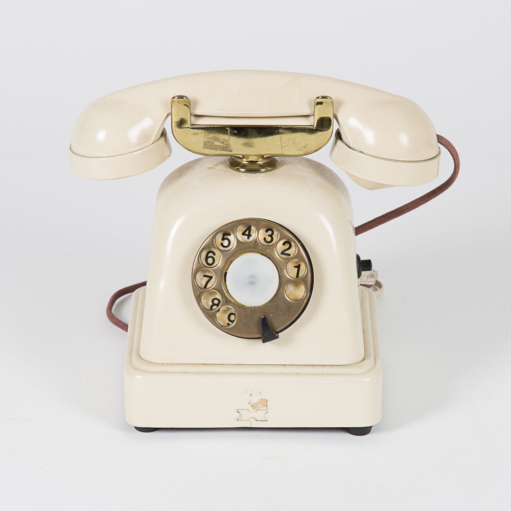 A Vintage Metal Cradle Telephone, 20th Century.: A Vintage Metal Cradle Telephone, 20th Century. H: 8 1/2 W: 10 D: 6 3/4 in.
