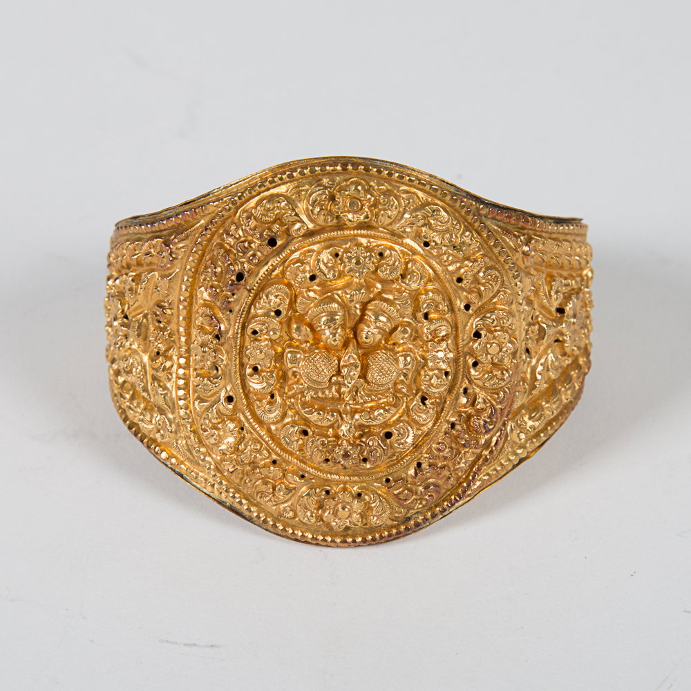 A Nepalese Newari Gold Repousse Cuff Bracelet, 19th: A Nepalese Newari Gold Repousse Cuff Bracelet, 19th Century, 14kt. yellow gold and 10kt. yellow gold plated. Total weight: 25.2 dwt. Opening dimensions: 2 1/2 x 2 in. L: 2 5/8 D: 2 1/2 in.