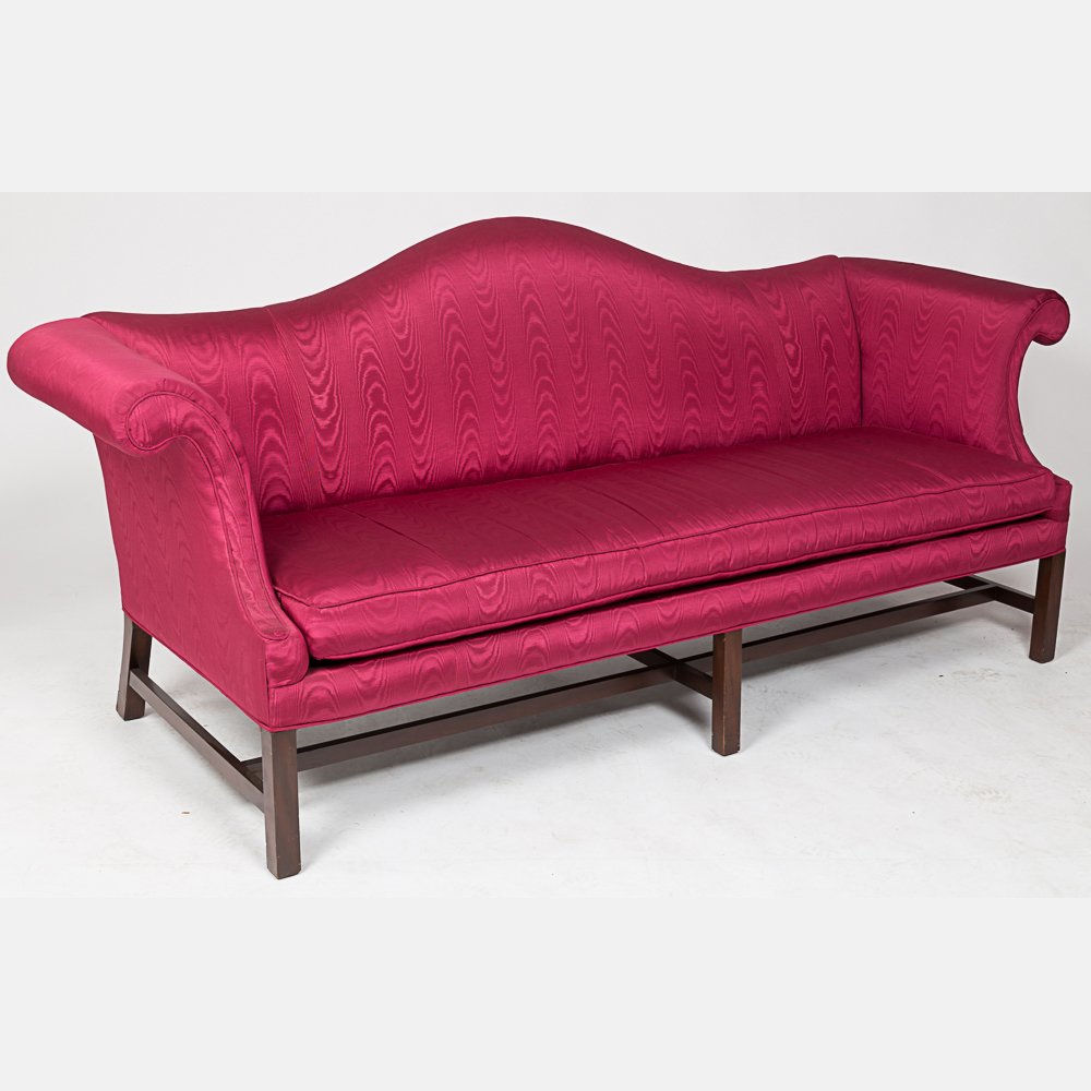 A Kittinger Chippendale Style Mahogany Camel Back Sofa: A Kittinger Chippendale Style Mahogany Camel Back Sofa with Silk Upholstery, 20th Century. H: 40 W: 67 D: 32 in. From the Estate of Terrence W. Burke.