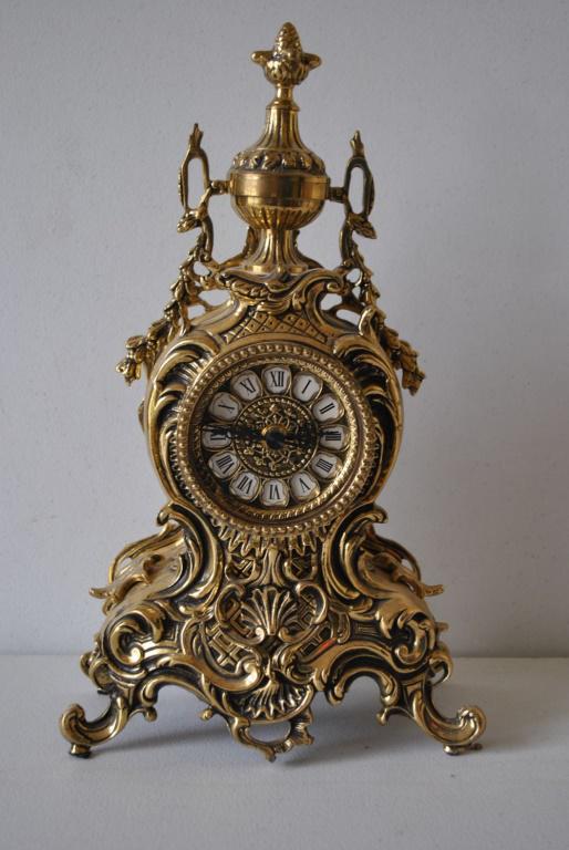 French Style Rococo Clock 16": Fine heavy, solid brass clock in the timeless Rococo style. Works are battery powered. Great Condition! 16H x 9.5W x 3D.