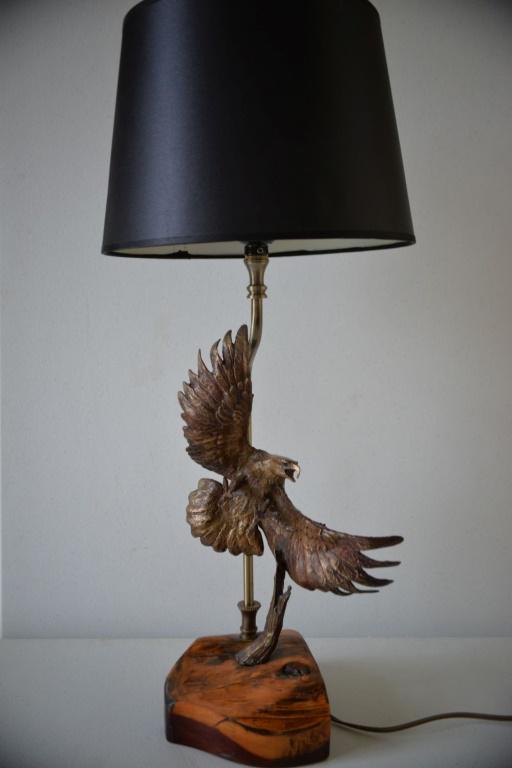 Clark Bronson Bronze Eagle Sculpture Lamp 23"H: Finely detailed bronze eagle sculpture lamp by Clark Everice Bronson born in 1939. Signed Bronson 1984. Very good condition. Works perfect. Excellent, heavy piece! 23 inches high mounted on a carved w