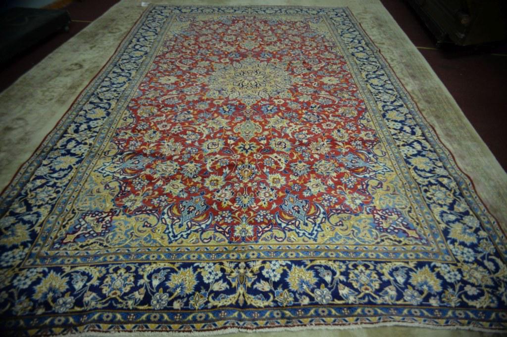 Persian Isfahan Hand Woven Rug 8.6 x 13 ft: Fine hand knotted rug in good condition! Ready to use! Rugs in the auction are a little darker and richer in color than the pics. Retail $5000. 8.6 x 13 ft.