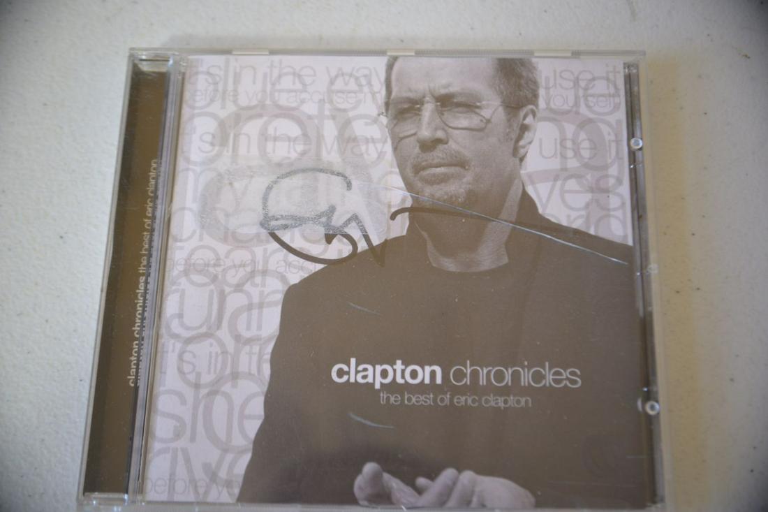 Signed Eric Clapton Chronicles CD: Signed Eric Clapton, one of the world's best known guitarist, singer, song writer! CD plastic cover has some wear. This piece is from a credible consignor. Congratulations to the winning bidder!