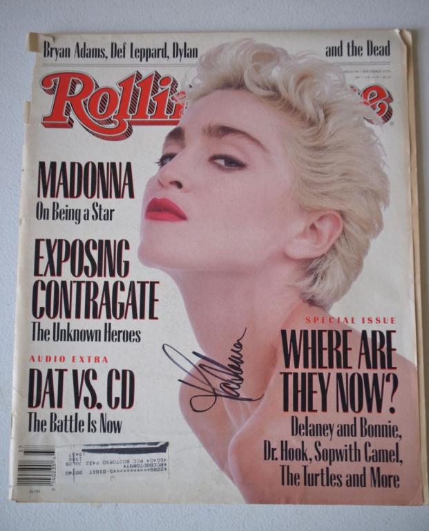 Signed Madonna Rolling Stone Magazine: The original virgin herself. Hand signed Madonna Rolling Stone Magazine! Magazine cover has minor wear wear on the front but has separated at the seams. This is from a credible consignor. We consider