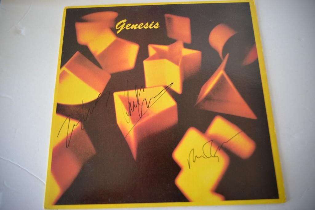 Signed Phil Collins, Peter Gabriel, Genesis: Collectible vintage album by Genesis signed Peter Gabriel, Phil Collins, and other. Good condition with minor wear.
