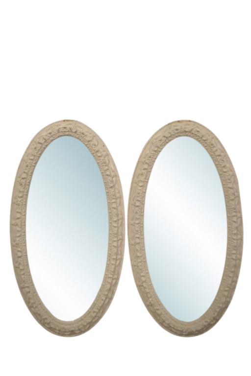 Pair of J. A. Olson Oval Mirrors: Fine pair of white, ornate, oval mirrors by J. A. Olson Company. Superb quality! Good condition with a small amount of paint and plaster missing on the end edge of each mirror. 47H x 24W x 2D.