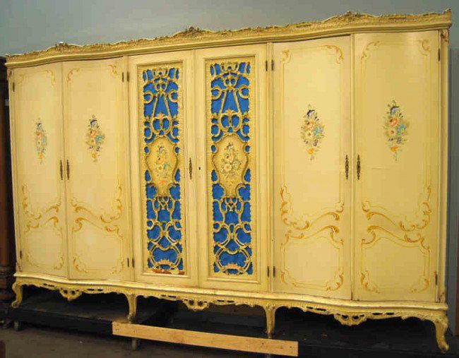 Italian Rococo 6 Door Handpainted Wardrobe: 10 Feet of storage and hand painted case highlighted by carved accents and open fretwork.measurements are: 10 feet wide, 78 inches tall and 24 inches deep.