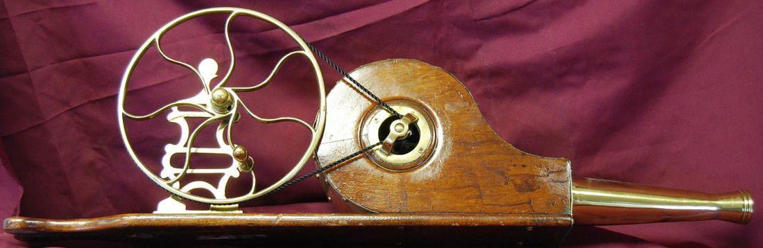UNIQUE BRASS & MAHOGANY MECHANICAL BELLOWS: WORKING, DECORATIVE HANDCRANK BELLOWS. NO MAKERS MARK TO BE FOUND. MEASURES 27 INCHES LONG, 5 INCHES WIDE AND 8 INCHES TALL.