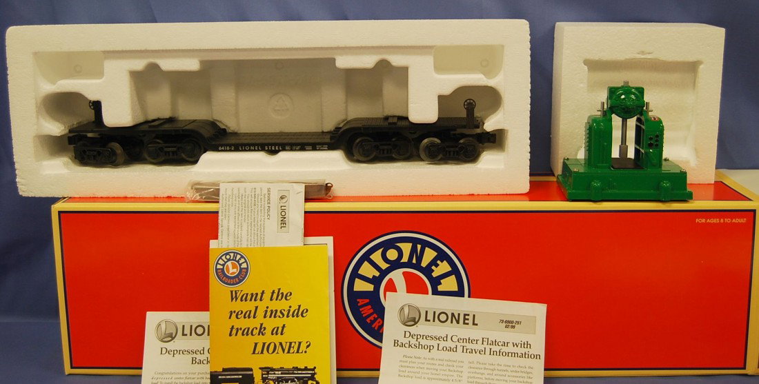 LIONEL O GAUGE DEPRESSED FLATCAR NIB: BOX STAMPED 11-99 ALL METAL MADE IN USA. COMPLETE WITH CARGO.