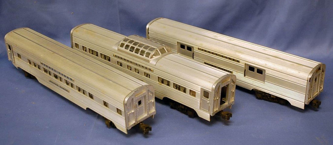 094: THREE LIONEL VINTAGE PASSENGER CARS O-GAUGE: ONE IS ACTUALLY A BAGGAGE CAR #2530, ONE IS THE OBSERVATION CAR #2532 AND ONE IS THE PULLMAN CAR # 2530. EACH COMES WITH ROUGH ORIGINAL BOXES